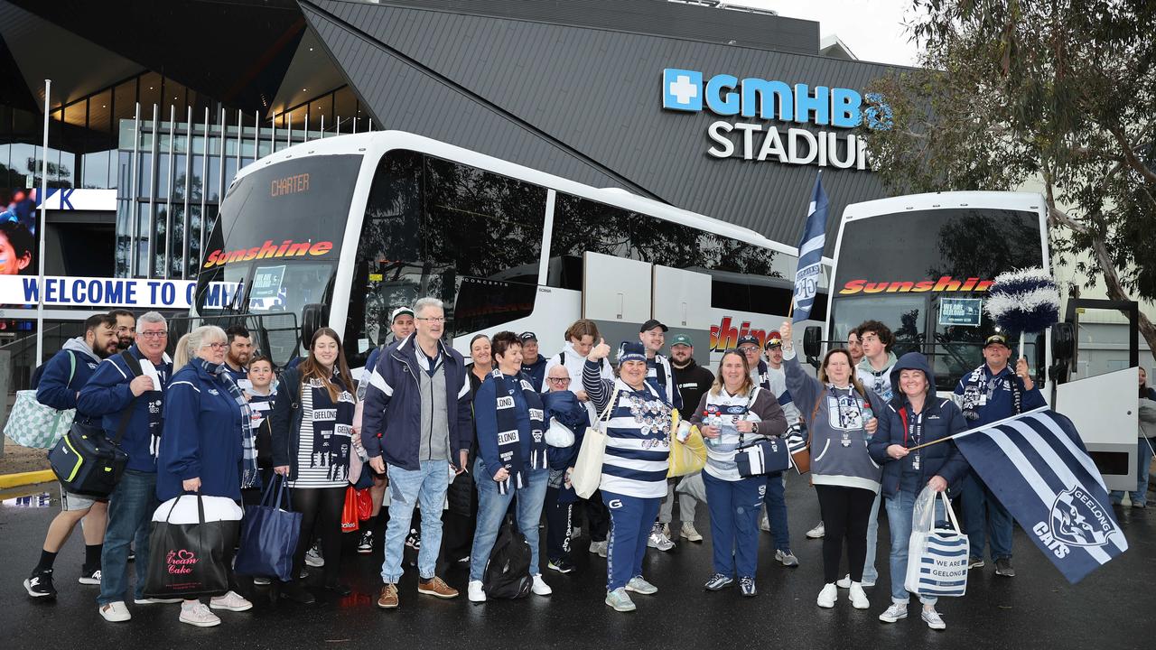 Cats fans prepare to leave Kardinia Park in a bus convoy to South Australia. Picture: Alison Wynd