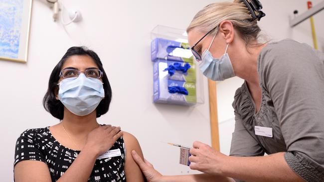 Dr Sumi Bhaskaran, Director, General Medicine, receives her second Pfizer COVID-19 vaccine from Immunisation Nurse Emily at Monash Medical Centre. Picture: Andrew Henshaw