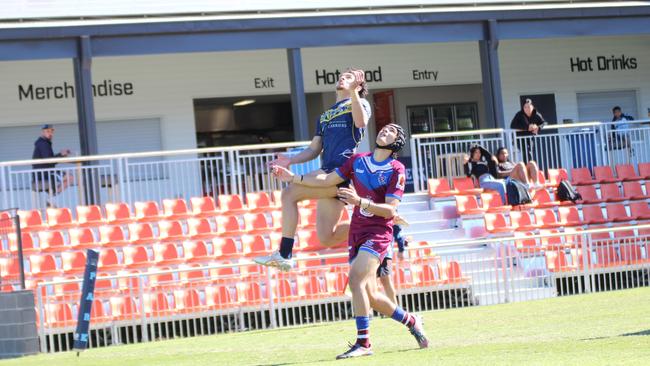 Tyson MacDonald leaping in the air and scoring a brilliant cross-field kick from Titus Marsden.