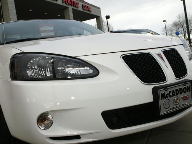 File-This Feb. 18, 2007, file photo shows an unsold 2006 Grand Prix sedan sitting outside a General Motors dealership in Boulder, Colo. General Motors’ safety crisis worsened on Monday, June 30, 2014, when the automaker added 8.2 million vehicles to its huge list of cars recalled over faulty ignition switches. The latest recalls cover seven vehicles, including the Chevrolet Malibu from 1997 to 2005 and the Pontiac Grand Prix from 2004 to 2008. The recalls also cover a newer model, the 2003-2014 Cadillac CTS. GM said the recalls are for “unintended ignition key rotation.” (AP Photo/David Zalubowski, File)