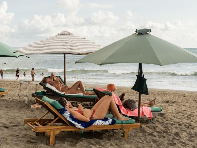 Tourists at the Batu Bolong surf beach in Bali. Picture: Agung Parameswara/Getty Images