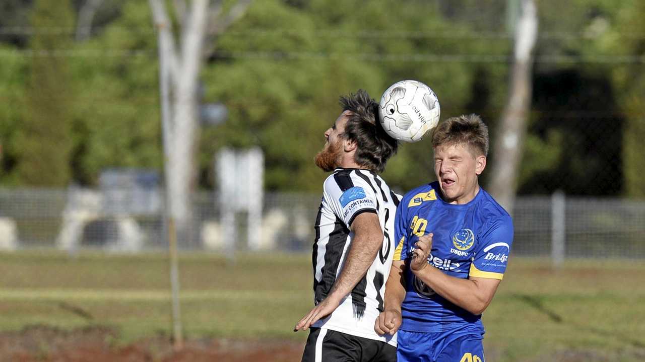 CLOSE RIVALS: Willowburn's Zac Taylor (left) and USQ's Willem Baines compete for the ball during a match earlier this season. The two sides will play in tomorrow's President's Cup final. Picture: Kevin Farmer