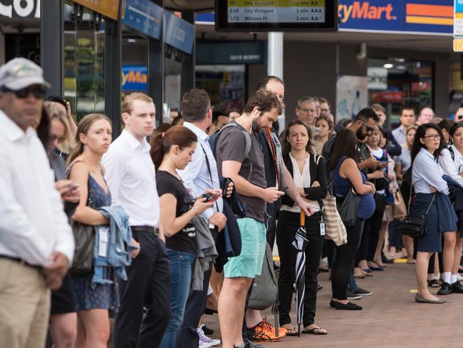 Commuters waiting for the B-Line at Mosman Junction.