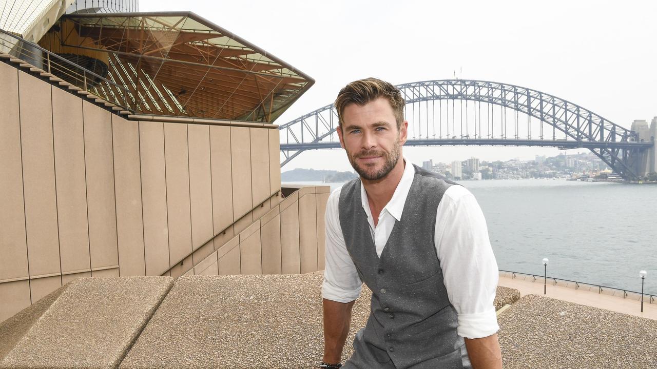 Actor Chris Hemsworth beside Sydney Harbour.