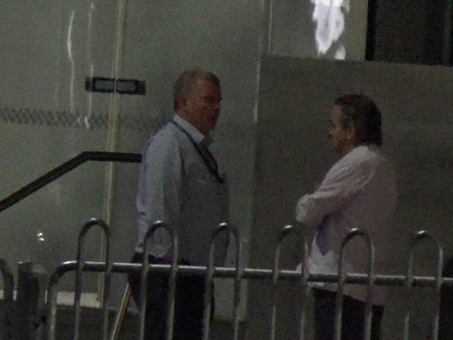 Detective Sergeant Wayne Dean (left) and Bill Meletsis meet outside Melbourne West police station on February 15, 2022. Picture: IBAC