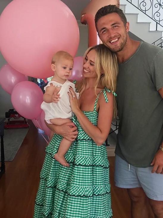 Sam Burgess with his wife Phoebe and their daughter.