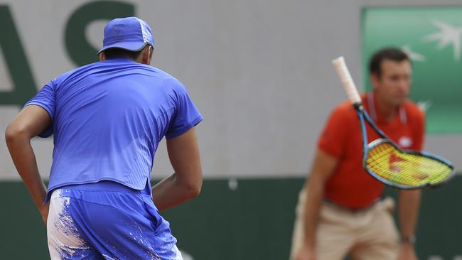 Australia’s Nick Kyrgios breaks a racquet during his loss to South Africa's Kevin Anderson at the French Open.