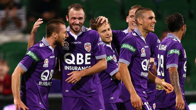 Nebojsa Marinkovic of the Glory celebrates a goal with teammates.