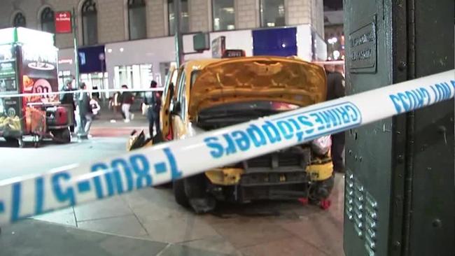 New York taxi jumps sidewalk outside Macy's on Christmas Day