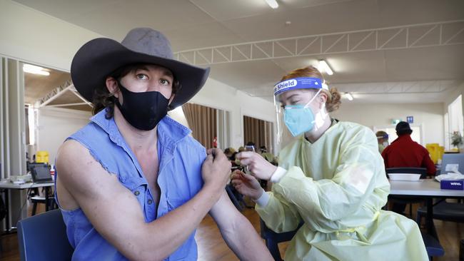 Private Jade Kinnear gives farmer Luke O’Connor his first dose at the ADF clinic at Dunedoo, an hour out of Dubbo. Picture: Chris Pavlich