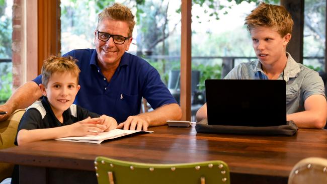 Felix and Max Jericho home schooling with dad Paul. Picture: Karen Jericho