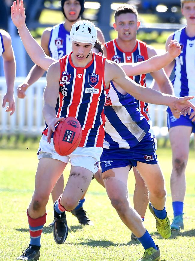 Action in the QAFL colts game between Mt Gravatt V Wilston Grange.