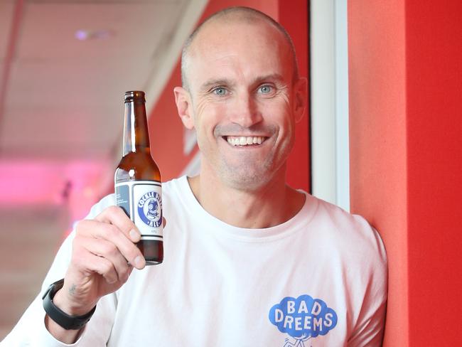 Pictured in Sydney is Ryan "Fitzy" Fitzgerald with a Cocklediver Ale beer - named after Fitzy's junior footy club Port Noarlunga Cockledivers.Picture: Richard Dobson