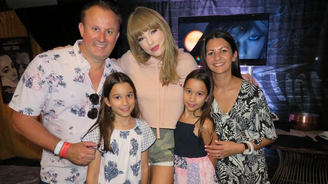 Nova's Jay Walkerden and Katie Mattin and their twin daughters Amelia and Holly backstage with Taylor Swift at her Brisbane concert late last year. Picture: Supplied via Shout Communications