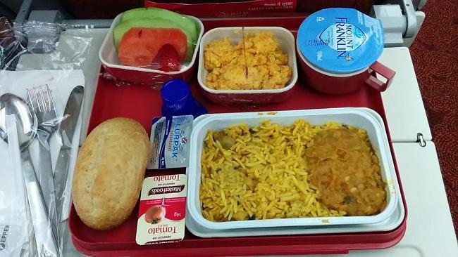 The first meal arrives several hours into the flight. Picture: Roderick Eime