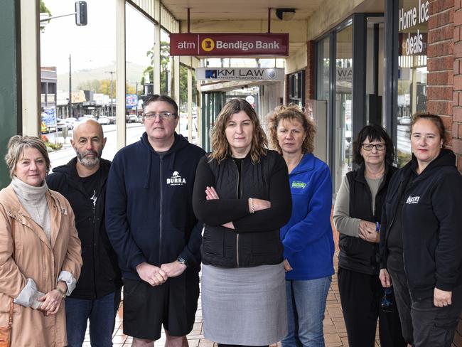 Local traders pictured outside the soon-to-close Bendigo Bank Branch and Korumburra: Jennie Keerie, Milpara Community House; Rick Arestia, Burra Barber, Phil Dempster, Burra Brewery; Shirley Arestia, Korrumburra Business Association Secretary; Kelly Hughes, Burra Garden Supplies; Kerry Martin, Burra Newsagency; Maria Condalucci, Kelly’s Bakery.