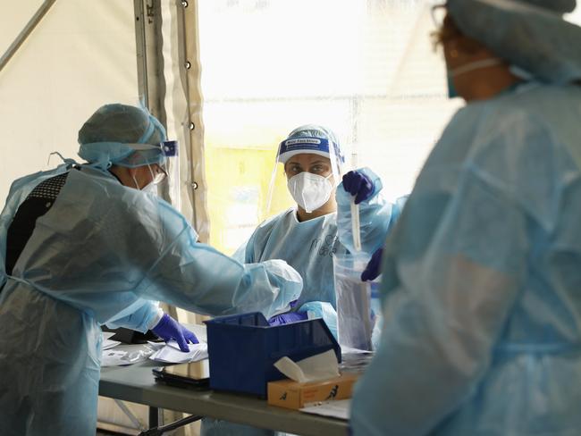 MELBOURNE, AUSTRALIA - NewsWire Photos SEPTEMBER 18, 2020:   Health workers are seen in full PPE at a pop-up COVID19 test site in Clyde, Melbourne, Victoria. Picture: NCA NewsWire / Daniel Pockett