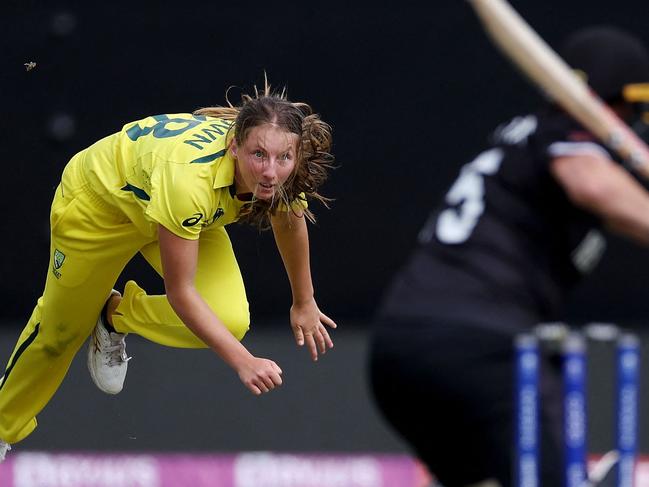 Australia's Darcie Brown (L) bowls to New Zealand's Katey Martin (R) during the 2022 Women's Cricket World Cup match between New Zealand and Australia at the Basin reserve in Wellington on March 13, 2022. (Photo by Marty MELVILLE / AFP)