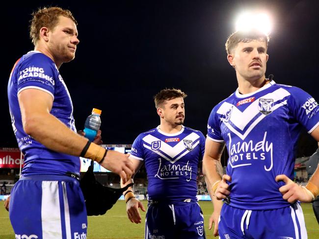 CANBERRA, AUSTRALIA - AUGUST 20: Matt Burton, Reed Mahoney  and Toby Sexton of the Bulldogs react at full timeduring the round 25 NRL match between Canberra Raiders and Canterbury Bulldogs at GIO Stadium on August 20, 2023 in Canberra, Australia. (Photo by Jeremy Ng/Getty Images)