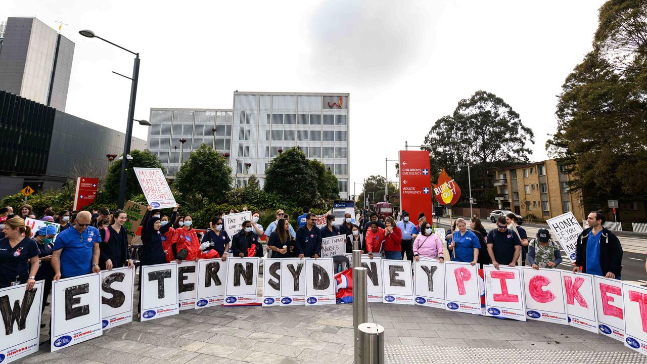 Staff stood together on the picket line outside Westmead Hospital during the 24-hour walkout. Picture: NCA NewsWire / James Gourley