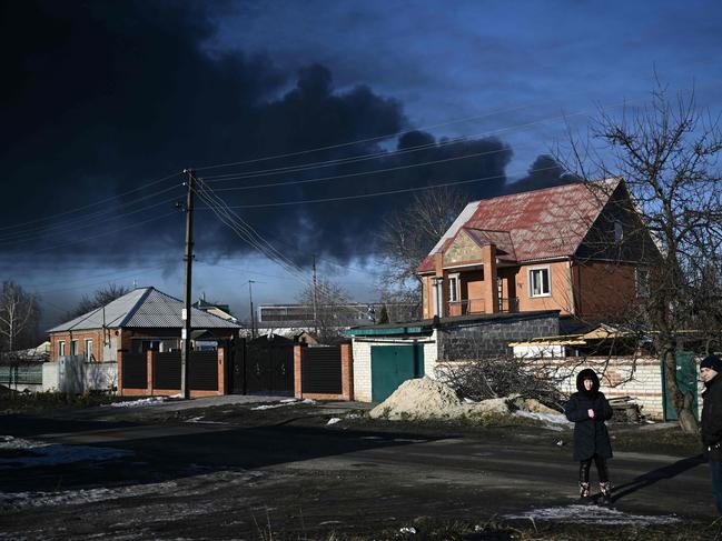 Black smoke rises from a military airport in Chuguyev near Kharkiv as Russian and Ukrainian forces battle for control of the air. Picture: AFP