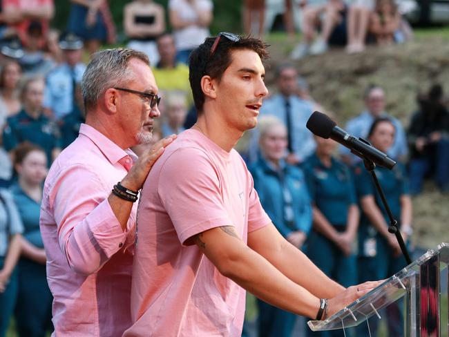 Hannah Clarke’s brother Nathaniel Clarke is supported by dad Lloyd during his speech at the vigil for her and her three children Aaliyah, 6, Laianah, 4, and Trey, 3. (AAP Image/Sarah Marshall)