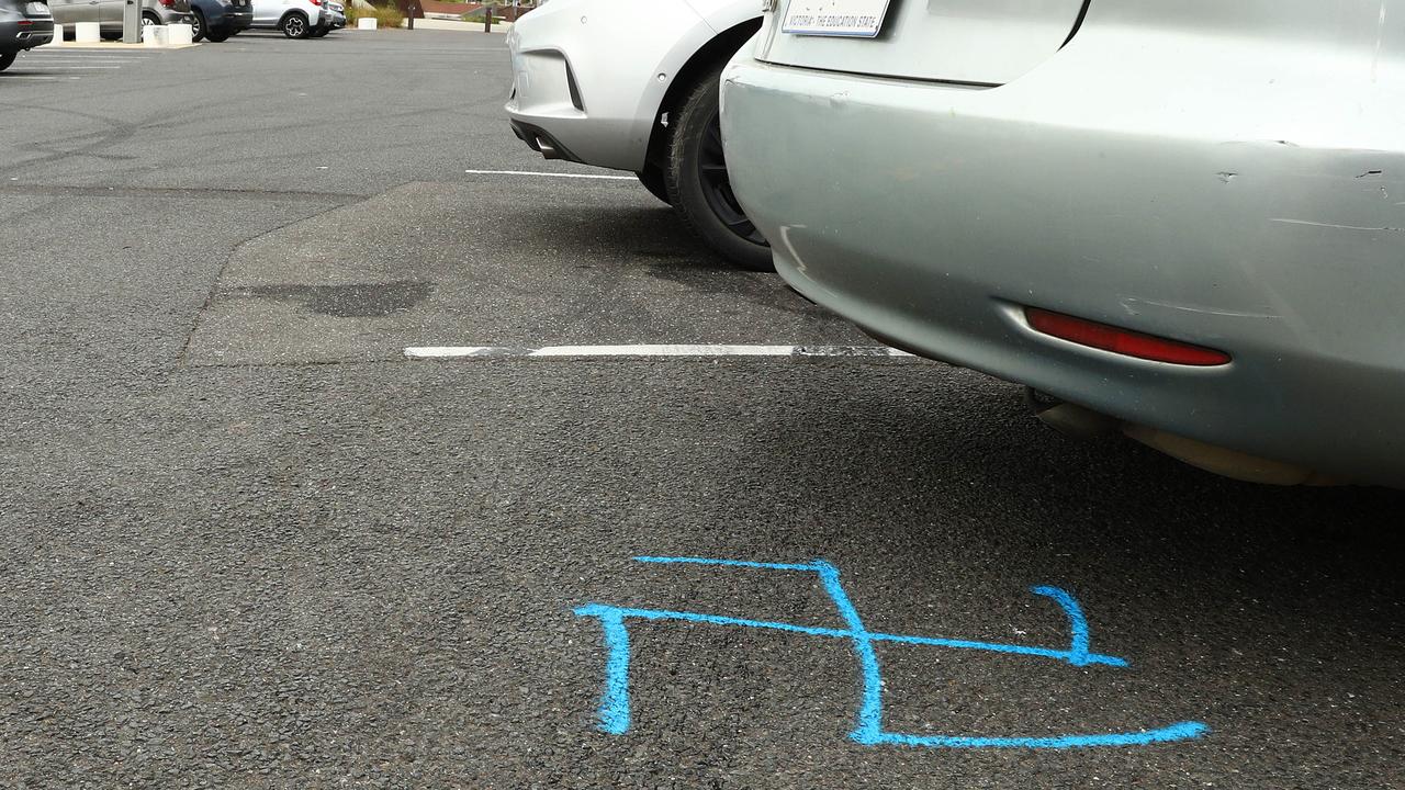 A swastika painted on the ground at Western Beach carpark. Picture: Alison Wynd