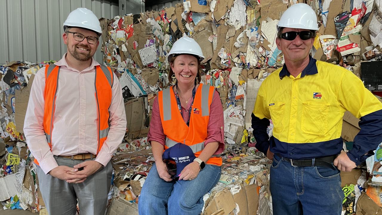 Mount Isa City Council's Chad King, Mayor Peta MacRae and recycling centre co-ordinator Richard Auld with the paper bales.