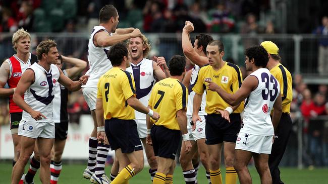 The chaos in the moments after Steven Baker’s shot at goal against Fremantle.