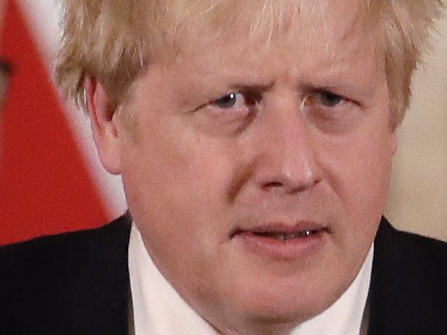 FILE - In this file photo dated Tuesday, March 17, 2020, Britain's Chancellor Rishi Sunak, left, and Prime Minister Boris Johnson arrive for a press briefing about the ongoing situation with the COVID-19 coronavirus outbreak, inside 10 Downing Street in London.  With British Prime Minister Boris Johnson hospitalized and in intensive care Wednesday April 8, 2020, after contracting the new coronavirus, Sunak is among key players in Johnson's Cabinet who will be directing Britain's response to the highly contagious COVID-19 coronavirus, while their leader is being treated. (AP Photo/Matt Dunham, FILE)