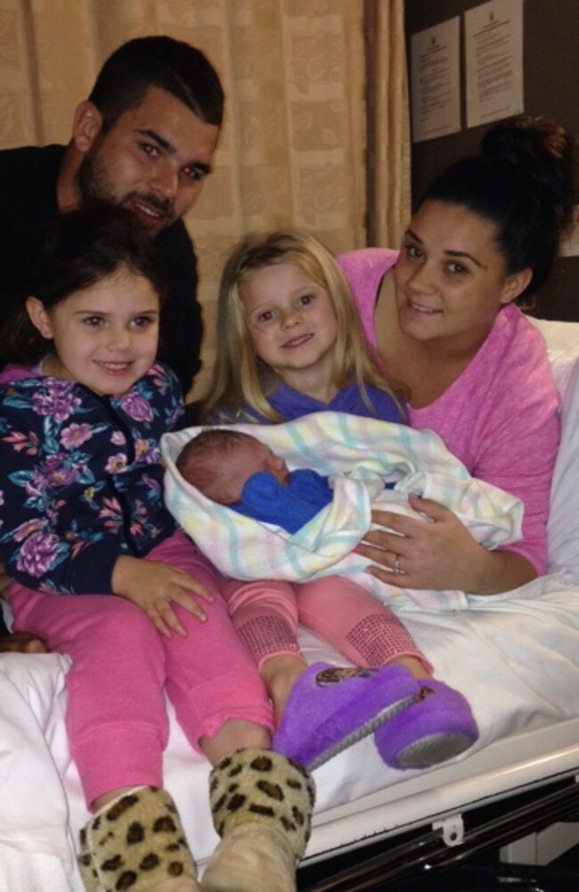 Adam Reynolds with partner Tallara, daughters Nakylah (L), Aaliyah (R) and new baby boy Kobe.