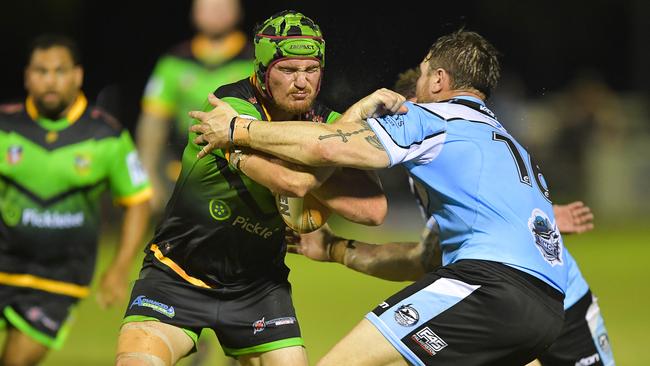 Palmerston’s Blake Fletcher braces for a tackle against Northern Sharks. Picture: Pema Tamang Pakhrin