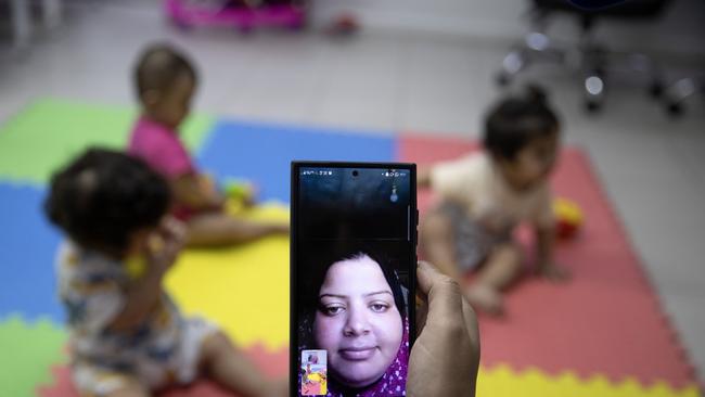 Hanan Bayouk video calls her triplets Najwan, Najme and Nur. Picture: Getty Images