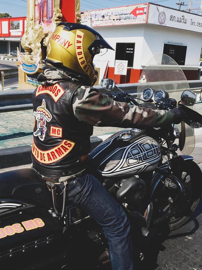 A Bandidos OMCG member rides through Thailand.