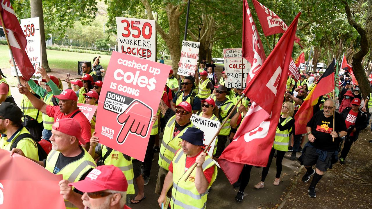 Protesters carrying placards are seen marching during an anti-Coles rally in Sydney on Saturday. Picture: NCA NewsWire/Bianca De Marchi