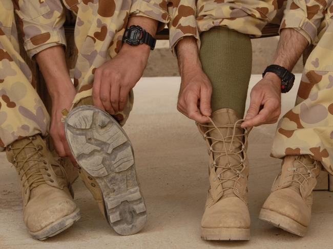 Generic image of a soldier wearing standard issue army boot (L) that costs $192 and the popular Altama desert boot that costs $245, with complaints by soldiers that the standard issue boot were not stong enough for battle and the Government will now issue soldiers with $192 standard issue price to buy their own boots.