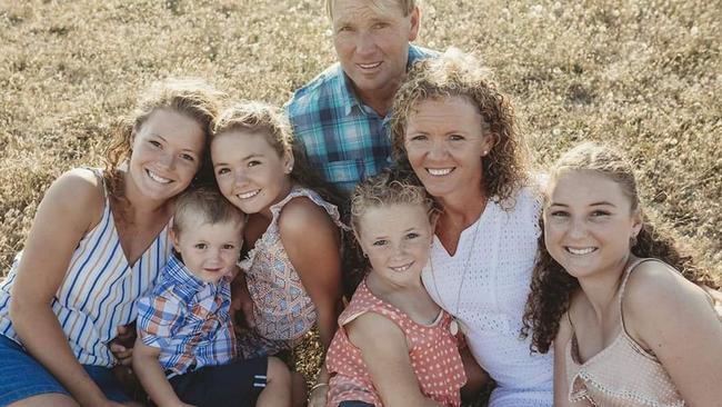 The Holloway family from Tooradin, Victoria who have been separated into three rooms and can't see each other. Mairead 18, Tom 4, Josie 13, Annie 10 Bridget 16 with dad Chris and mum Sarah.