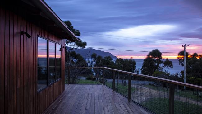 The stunning view of a sunrise over Eaglehawk Neck, from the deck of Teralina Beach House. Picture: Eloise Emmett