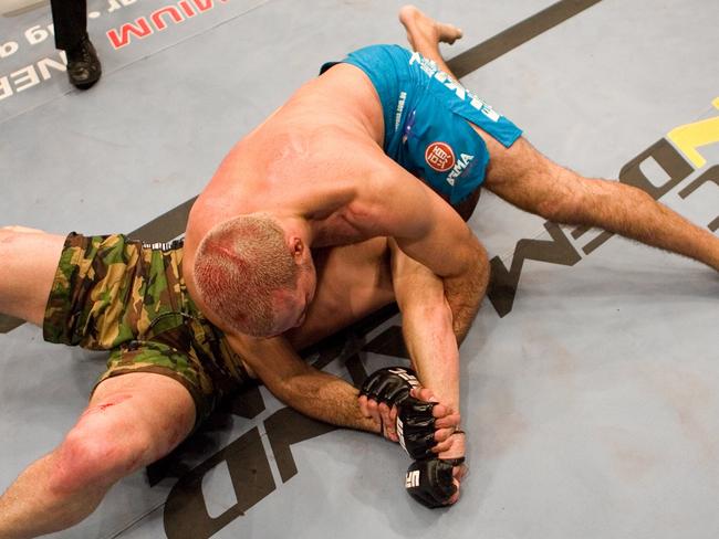 Sinosic (blue shorts) attempts to submit Michael Bisping at UFC 70 in Manchester in 2007. Picture: Josh Hedges/Zuffa LLC/Getty Images