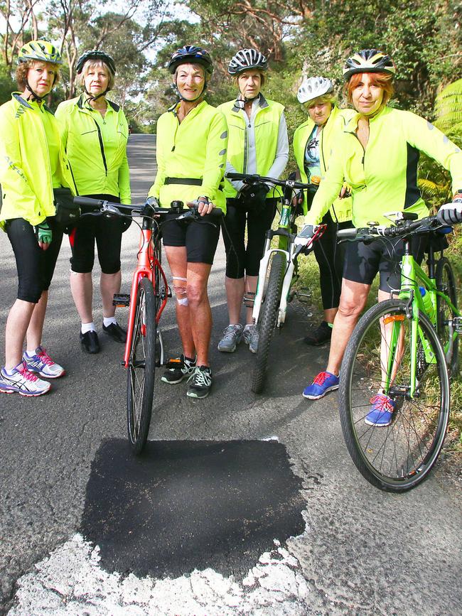 The cyclists, pictured last year, at the old pothole. Picture: Phillip Rogers