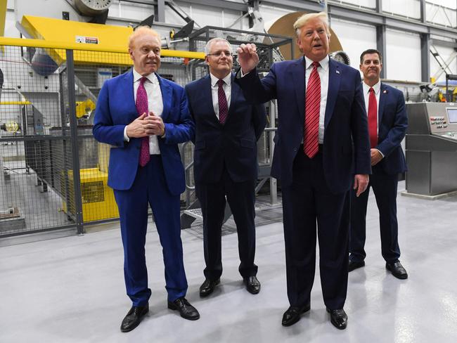 US President Donald Trump (C) speaks as Global Chairman of Pratt/Visy Industries Anthony Pratt (L) and Australian Prime Minister Scott Morrison look on during a visit to Pratt Industries plant opening in Wapakoneta, Ohio on September 22, 2019. Picture: AFP