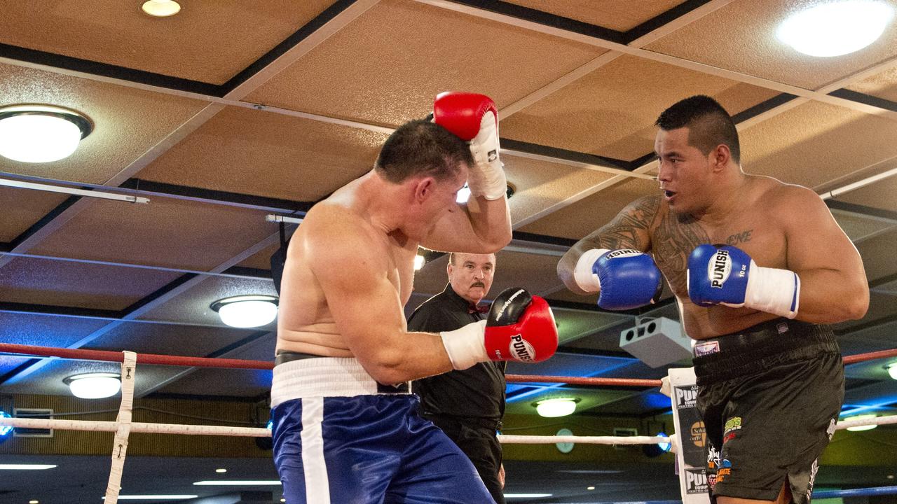 Paul Gallen and Herman Ene-Purcell fight it out in Toowoomba. Friday, Jan 29, 2016.