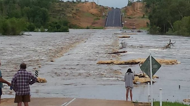 A flooded Etheridge River bridge at Georgetown, about 280km southwest of Cairns. Heavy rain on Sunday night has broken the shire's dry spell.