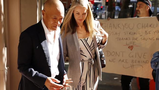 Neurosurgeon Charlie Teo and his fiance Traci Griffiths are greeted by supporters as they are arrive at the Health Care Complaints Commission hearings. Picture: Tim Hunter