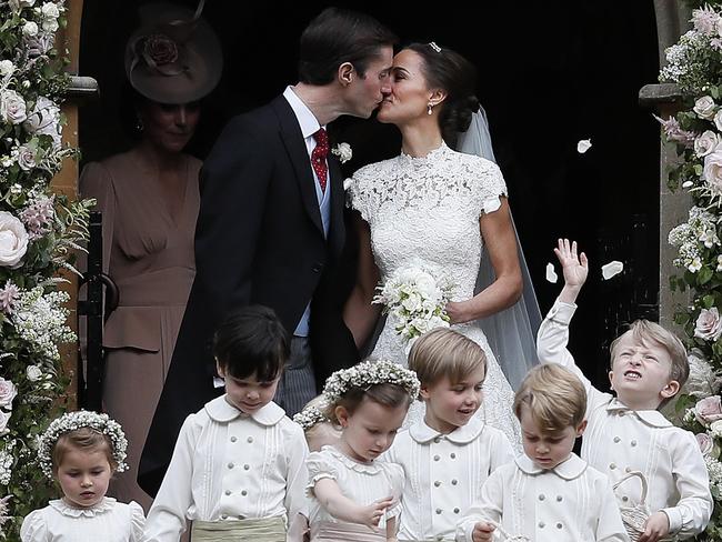 Pippa Middleton and James Matthews kiss after their wedding at St Mark's Church in Englefield. Picture: Kirsty Wigglesworth.