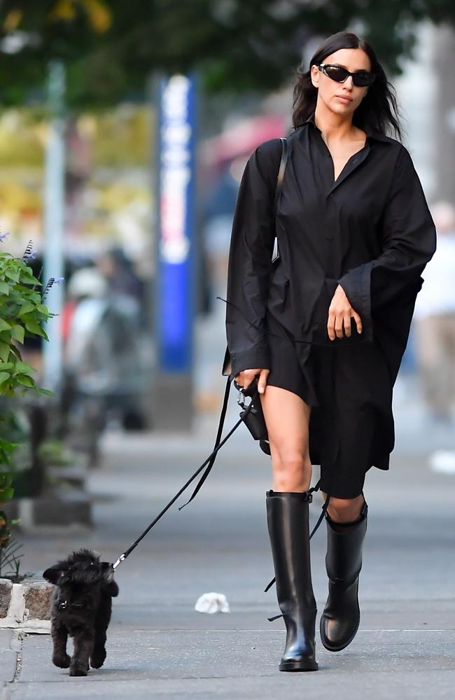 Perfectly matching her dog in an all black outfit, model Irina Shayk walks the streets of New York City. Picture: Robert O’Neil / BACKGRID