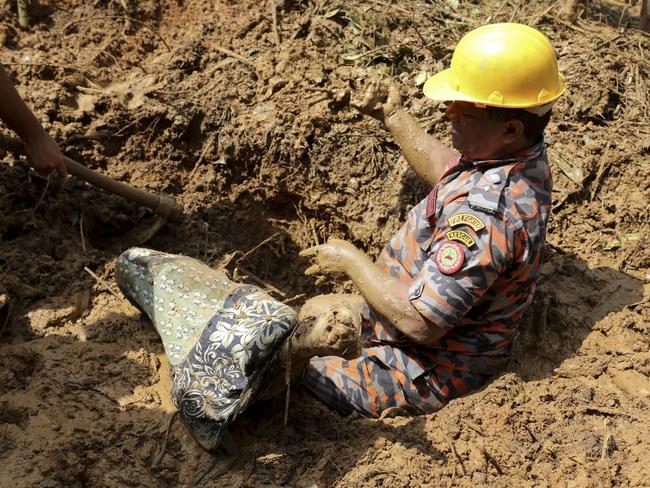 Rescuers prepare to pull out the dead body of a victim after Tuesday's massive landslide in Rangamati district, Bangladesh. Picture: AP Photo