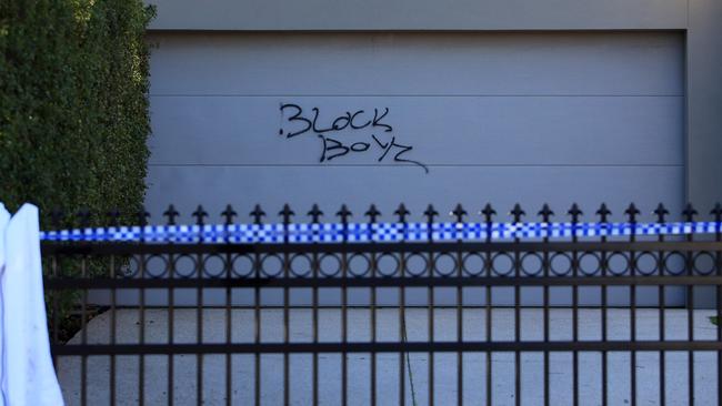 Graffiti on a garage door of the Hawthorn East home which was trashed after the party. Aaron Francis/The Australian