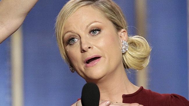 This image released by NBC shows co-hosts Tina Fey, left, and Amy Poehler on stage during the 70th Annual Golden Globe Awards...