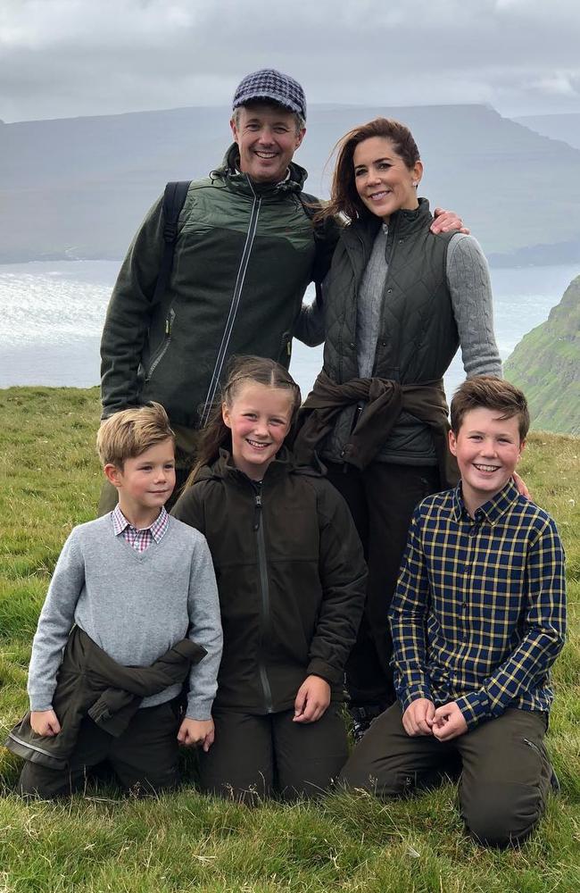 The family pose for a photo after climbing Mount Eystfelli in the Faroe Islands. Picture: Kongehuset